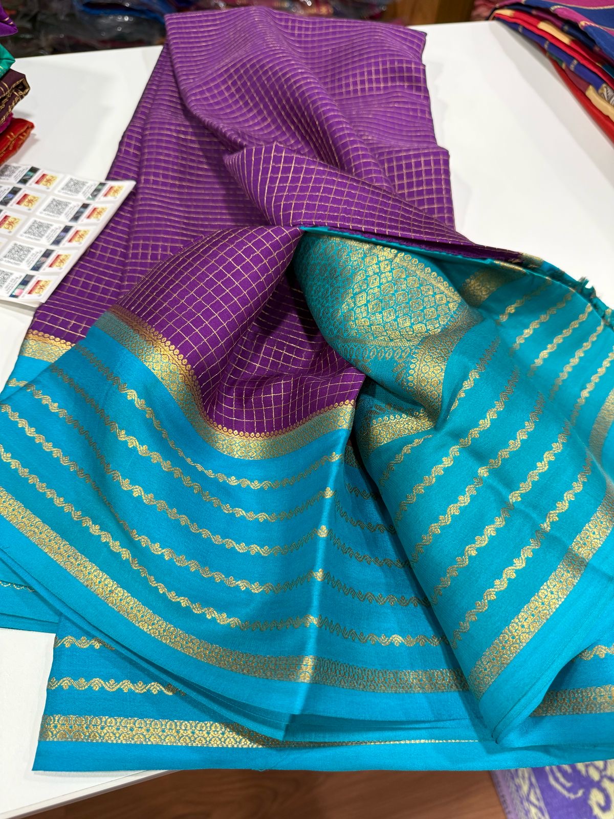 Small checks contrast with rich pallu