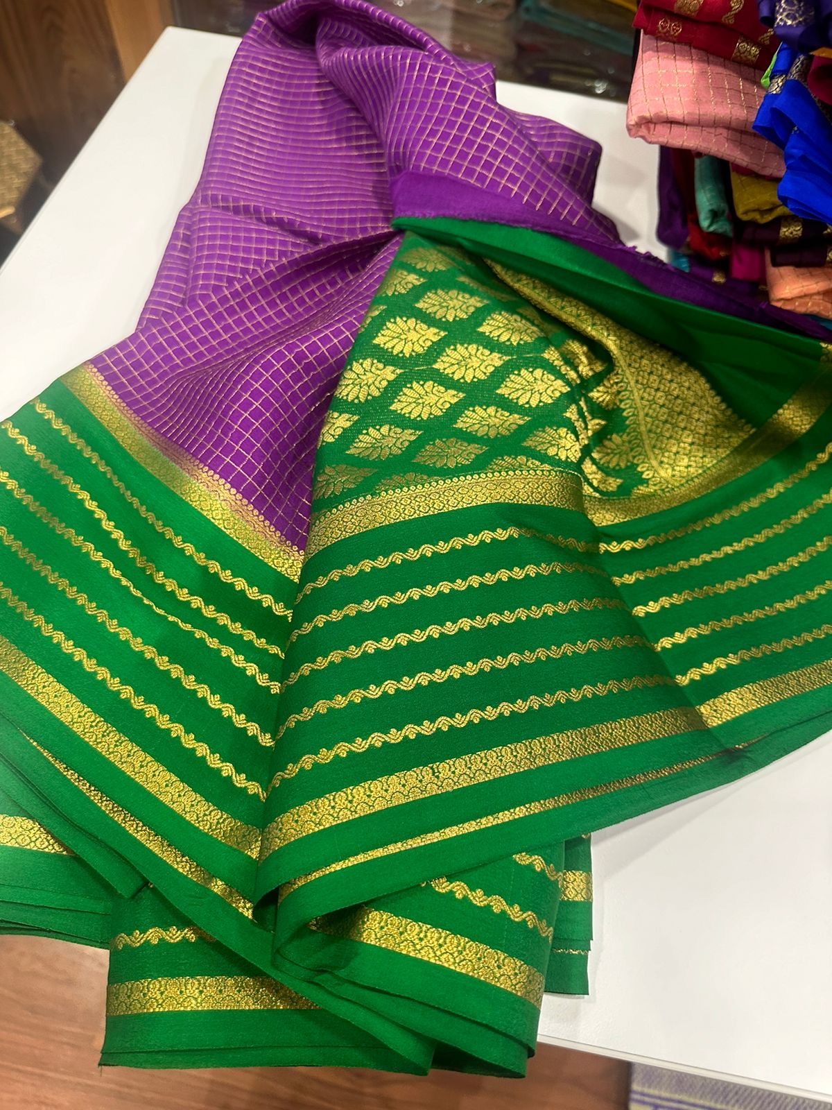 Small checks contrast with rich pallu