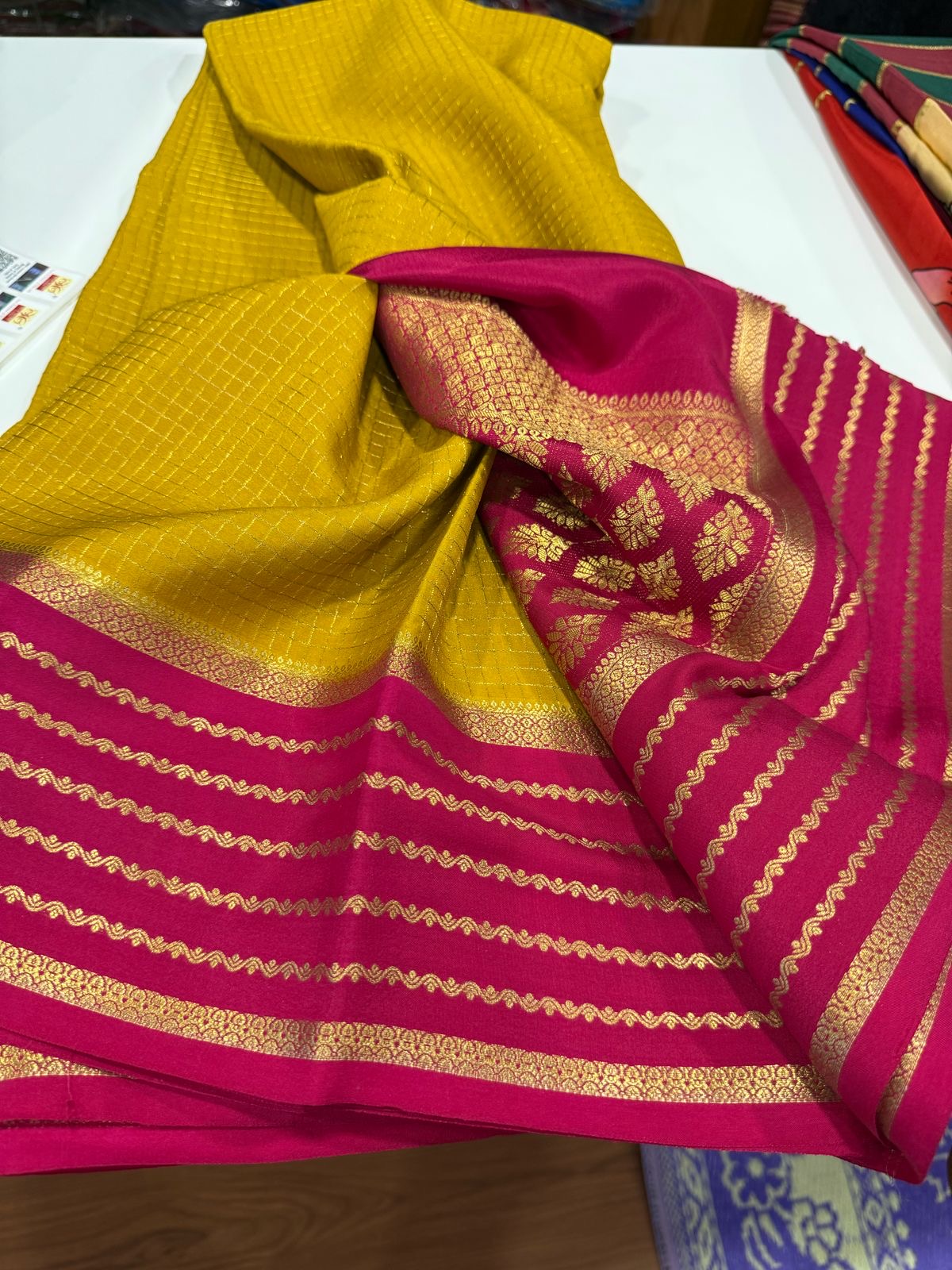 Small checks contrast with rich pallu