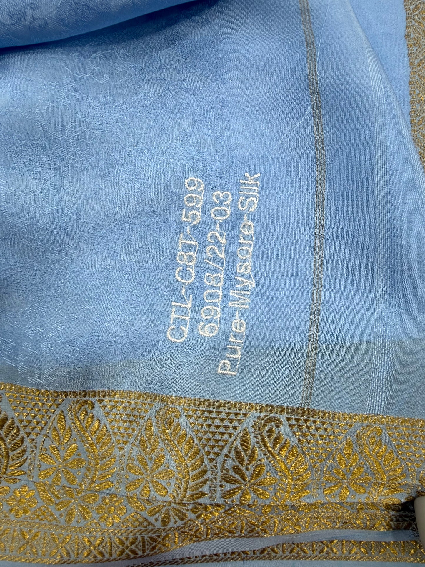Embossed gold lace