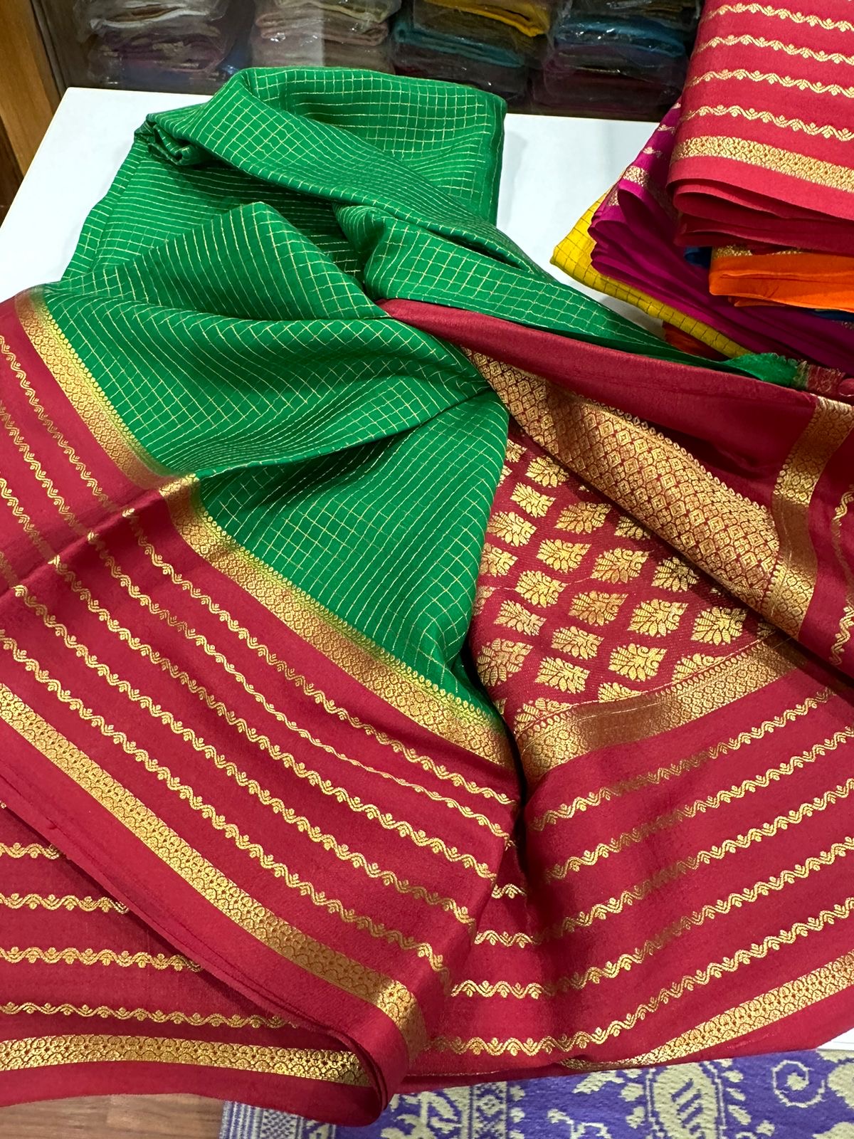 Small checks contrast with rich pallu