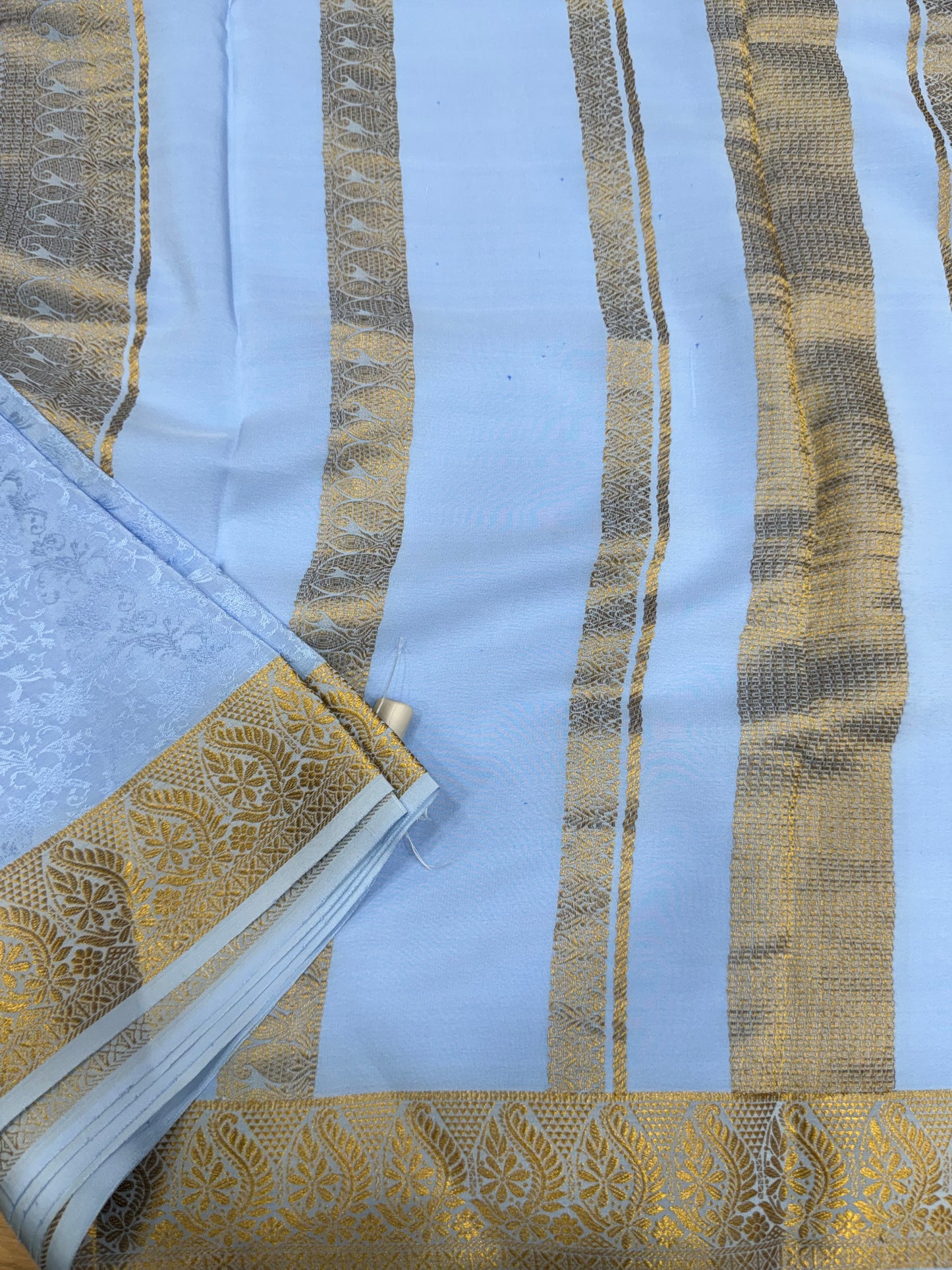 Embossed gold lace