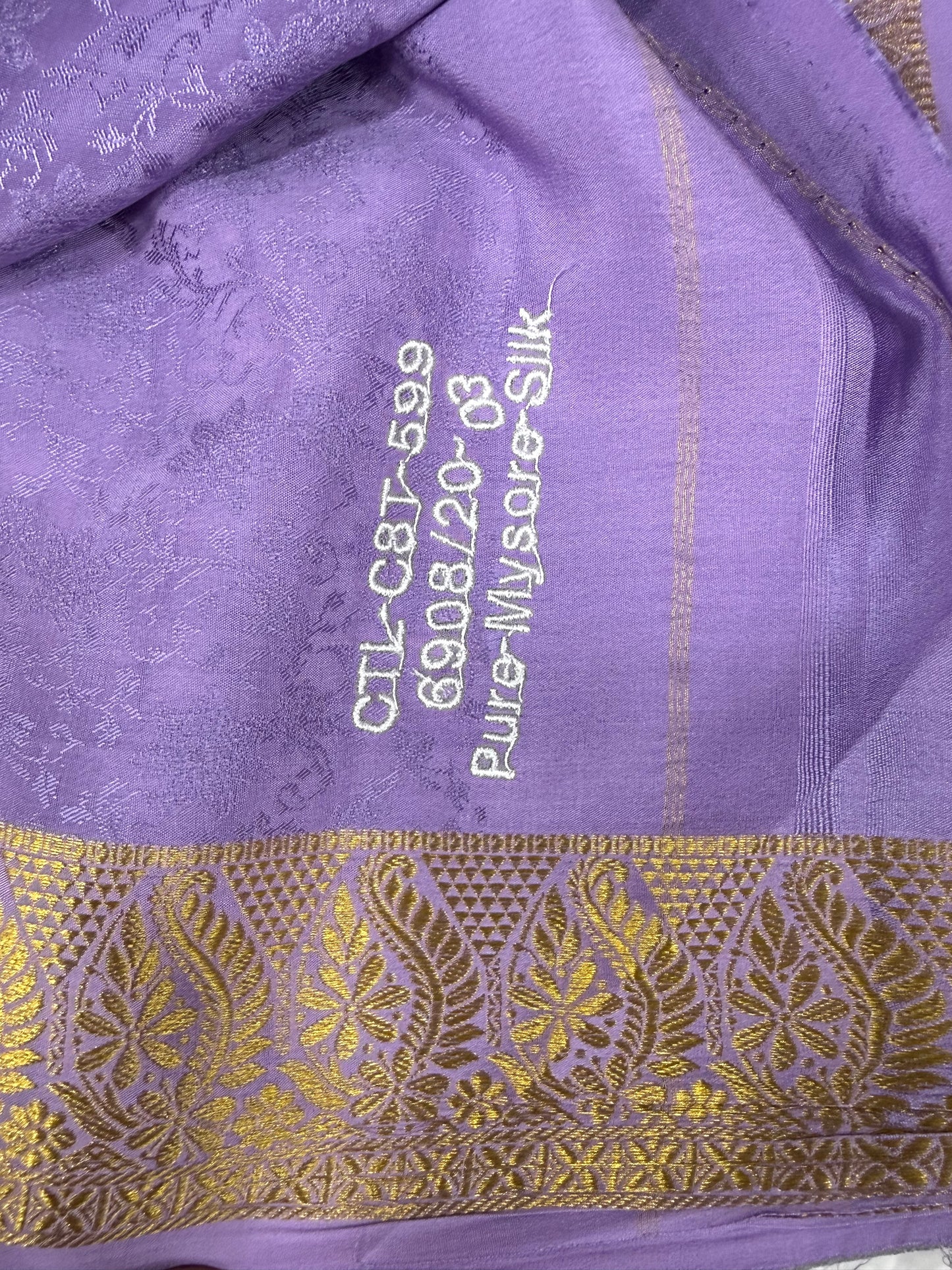 Embossed gold lace