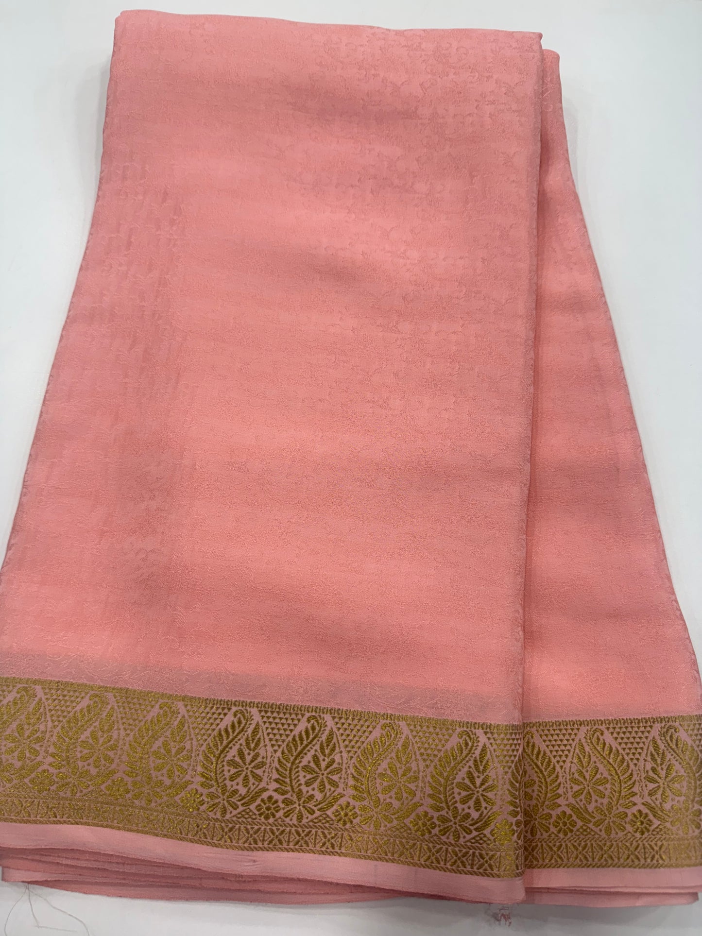 Embossed gold lace