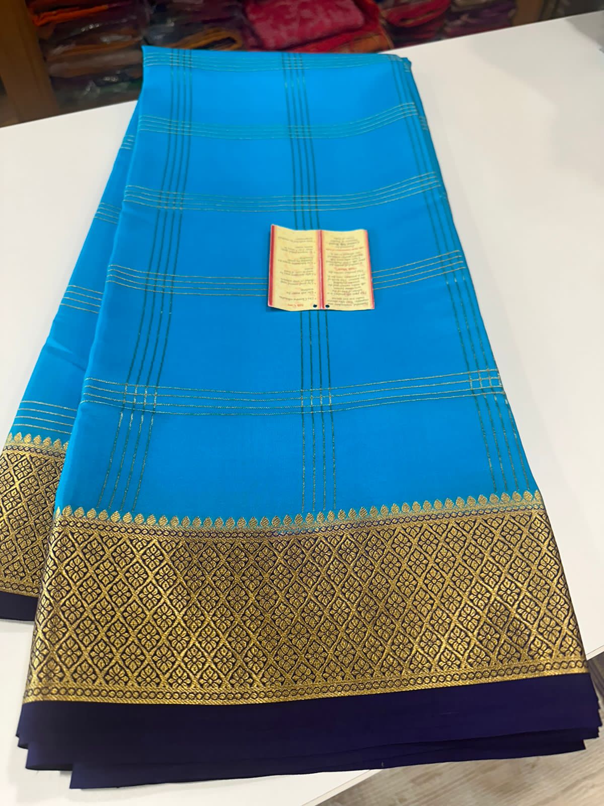 Double line checks pattern with rich Pallu